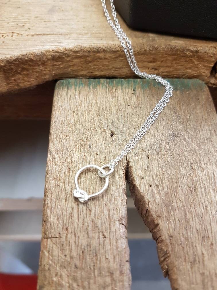 Contemporary sterling silver knot necklace