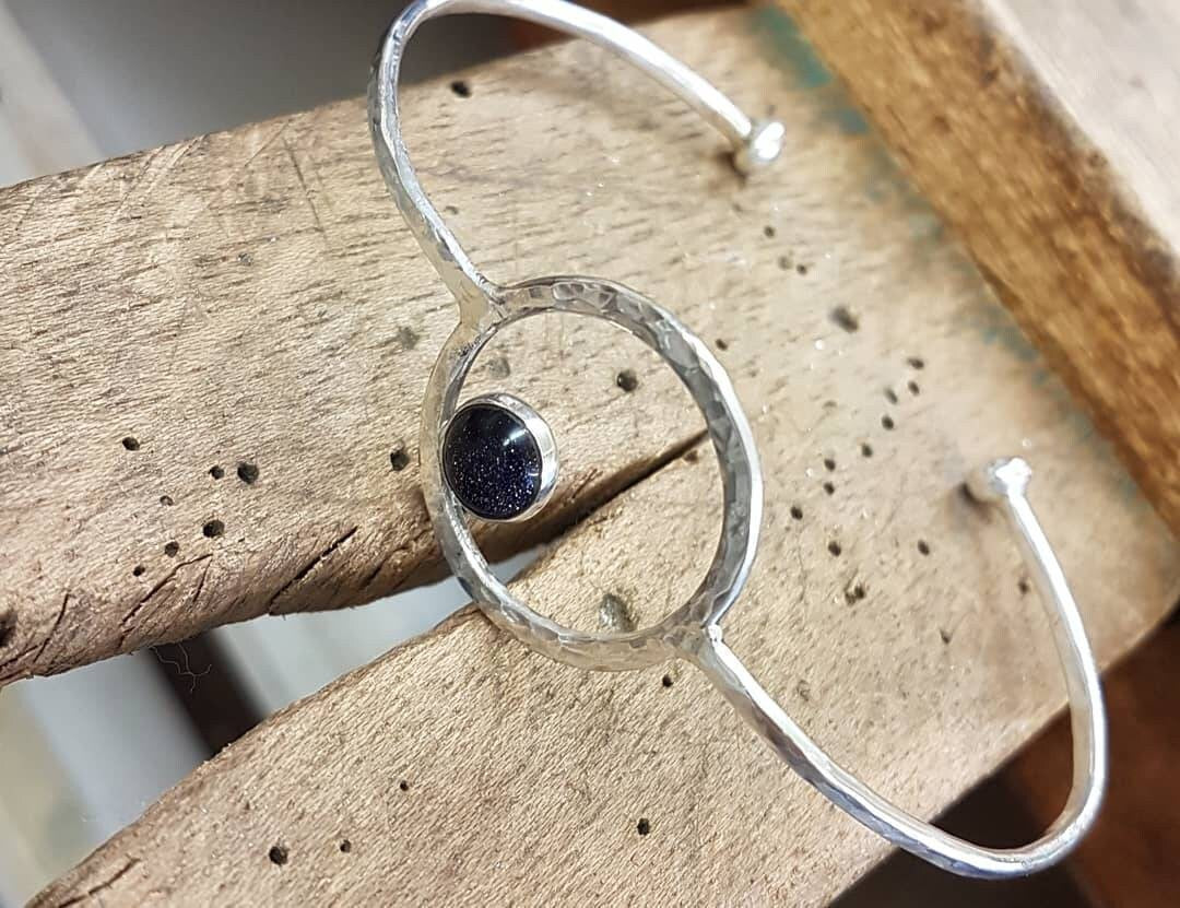 Contemporary Silver Hammered Blue Goldstone Bangle