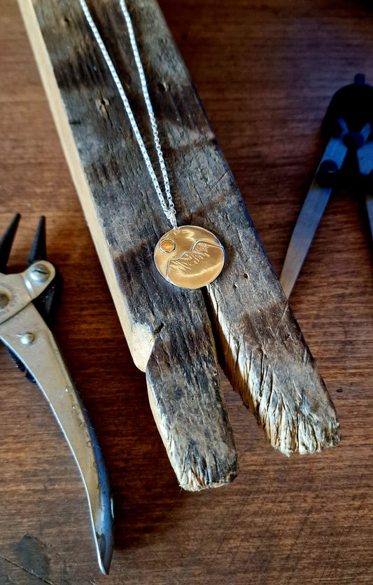 Round Silver and Brass Mountain Pendant
