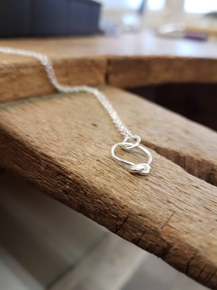 Contemporary sterling silver knot necklace